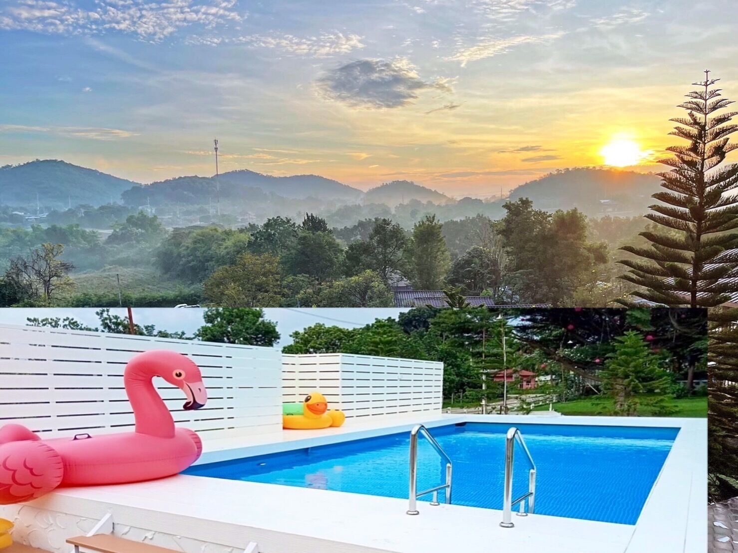 A swimming pool with a view of mountains and a sunset.