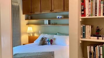 1 bedroom, desk, iron/ironing board, travel crib