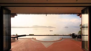 An indoor view of a terrace with a pool, seating area, and a view of the sea and islands. - 5 Bedroom Sea Front Villa SDV231 - Koh Phangan-By Samui Dream Villas (Ko Pha-ngan)