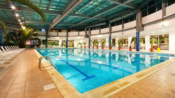 Indoor pool, pool umbrellas, sun loungers