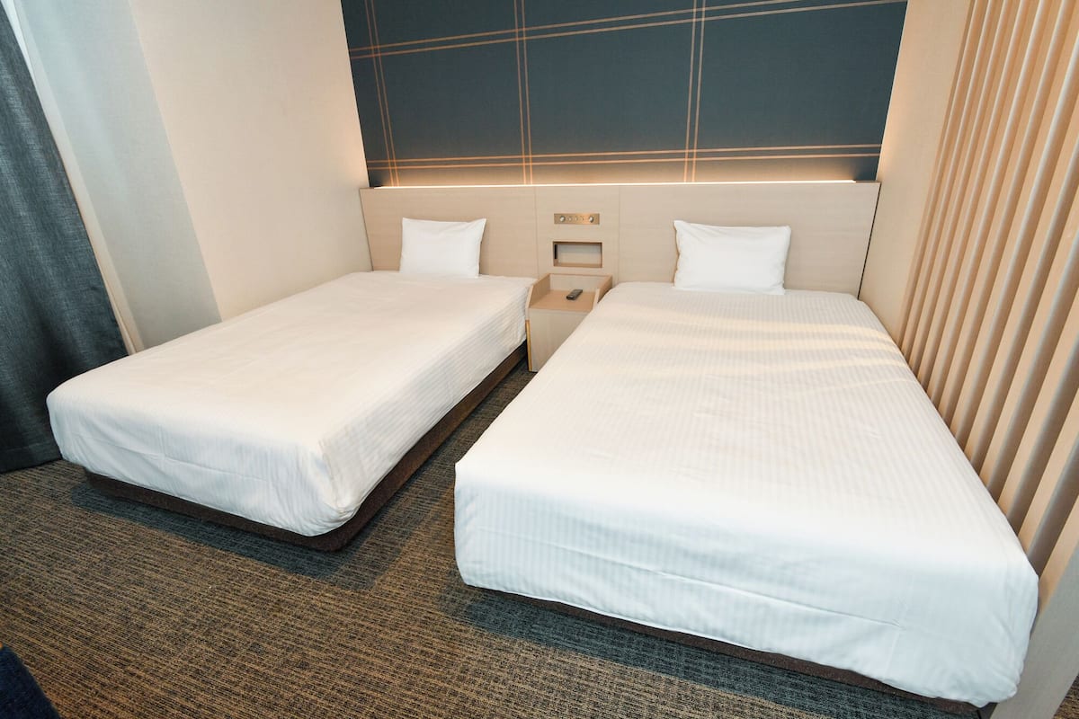 Standard Twin Room | Desk, blackout curtains, iron/ironing board, free WiFi