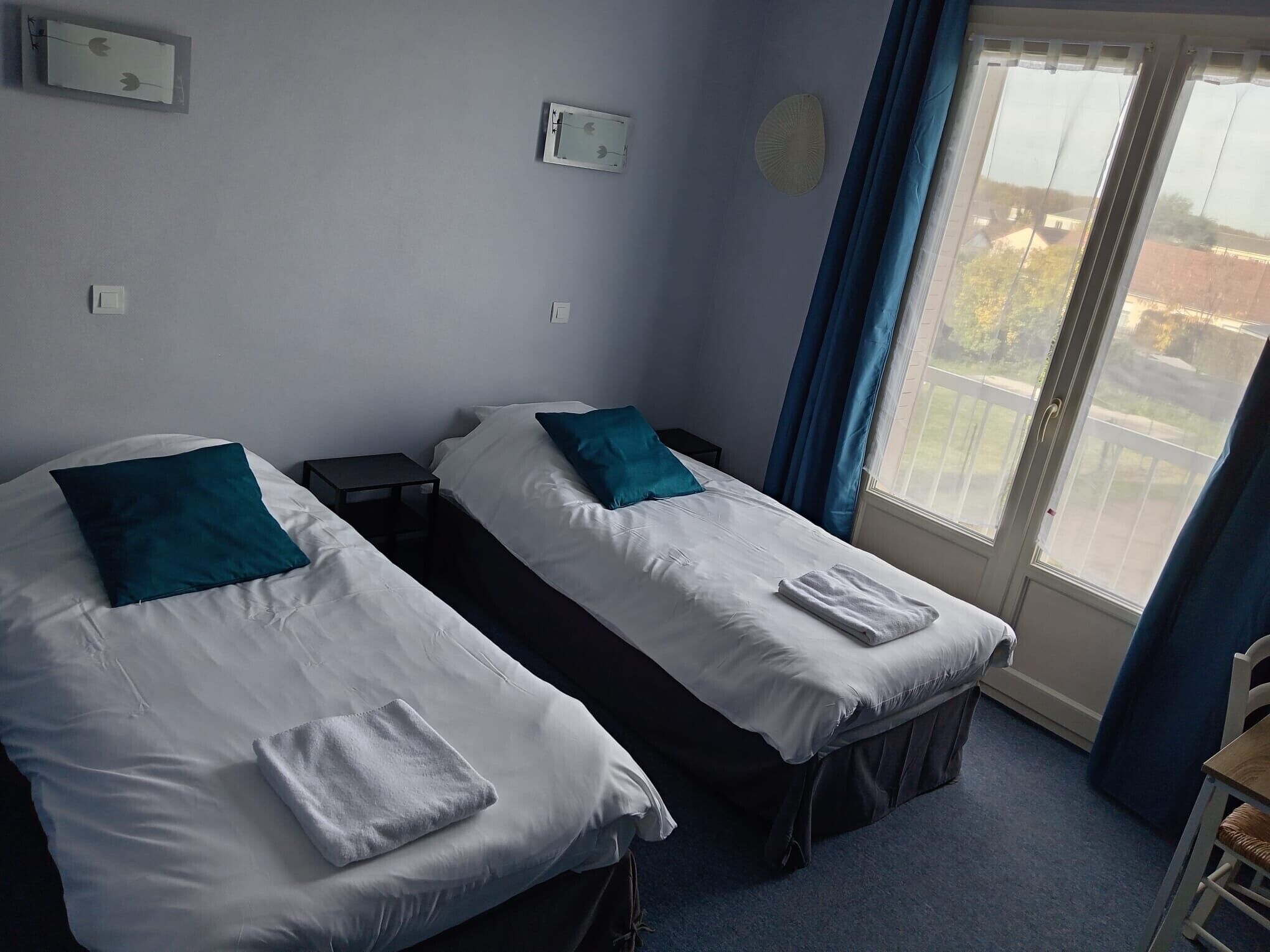 Desk, laptop workspace, iron/ironing board, free cribs/infant beds