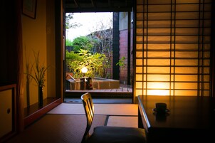 Standard Japanese Western Style Room with Open Air Bath (From 2 people) | Living room | Flat-screen TV