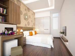 A modern hotel room with a large bed, a desk with a computer, a bookshelf, and a large window with curtains. - Hotel Bel Ami Hanoi (Hanoi)