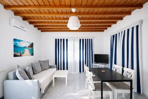 Superior Apartment, 1 Bedroom, Sea View | Living area | 32-inch flat-screen TV with digital channels, TV - Villa Oceania (Mykonos)