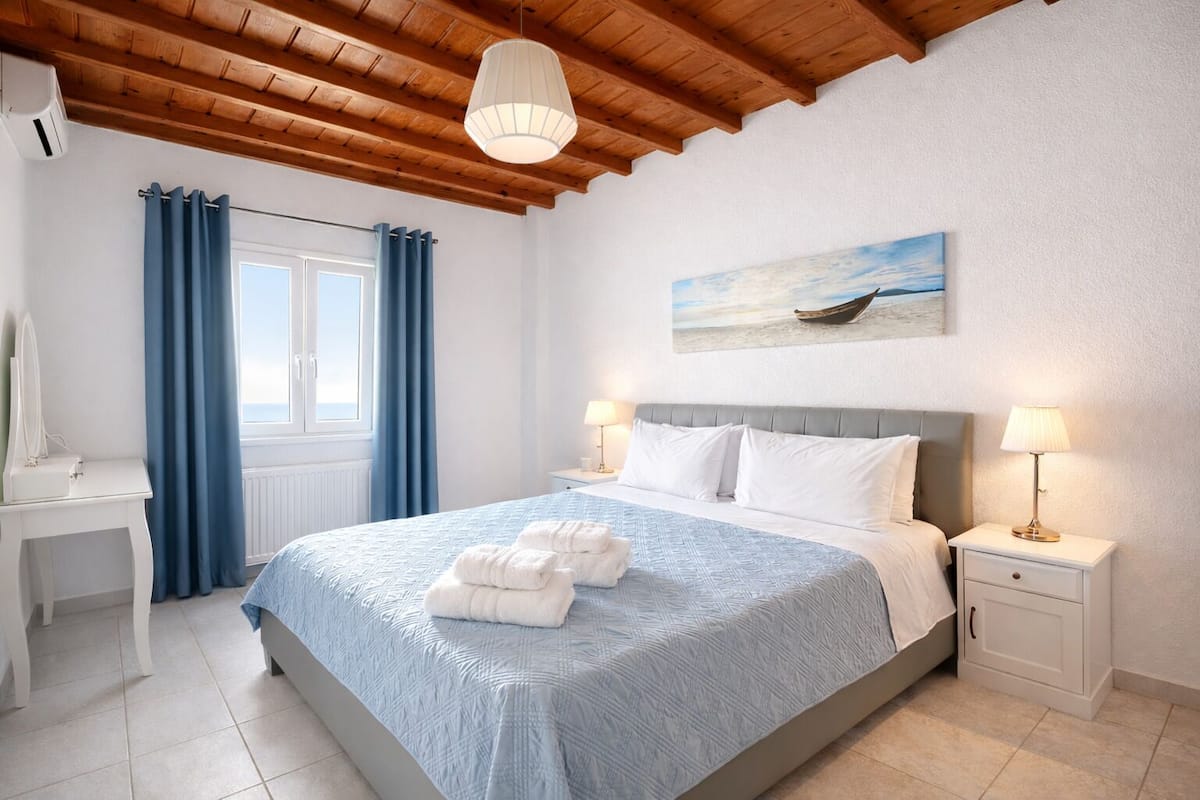 Apartment, 2 Bedrooms, Sea View | Minibar, in-room safe, soundproofing, iron/ironing board