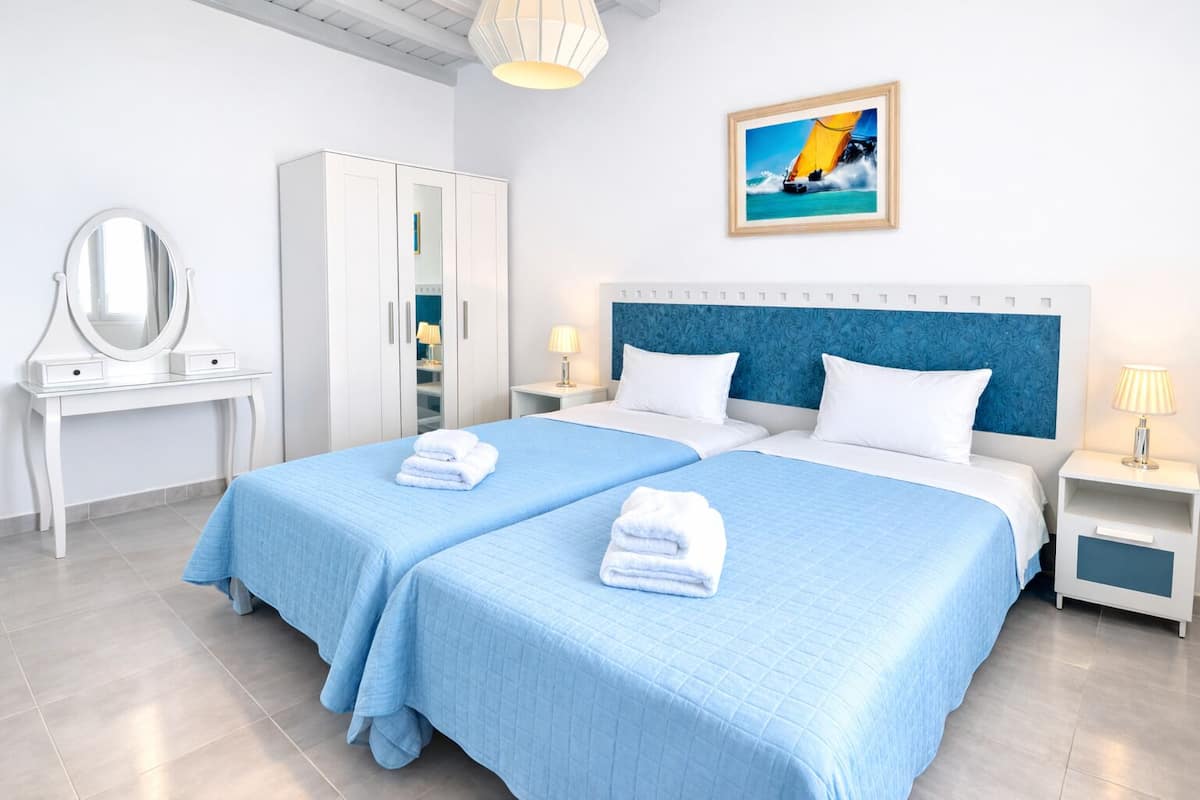 Apartment, 1 Bedroom, Sea View | Minibar, in-room safe, soundproofing, iron/ironing board