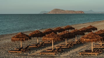 On the beach, sun-loungers, beach umbrellas