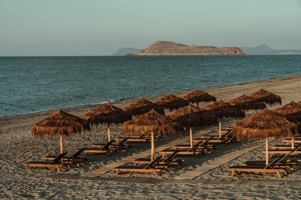 On the beach, sun loungers, beach umbrellas