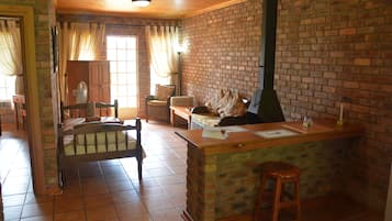 Bungalow (Twin) | Living area | TV, fireplace