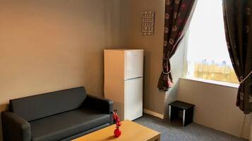 Apartment, 1 Bedroom | Living area | 20-inch flat-screen TV with cable channels, TV