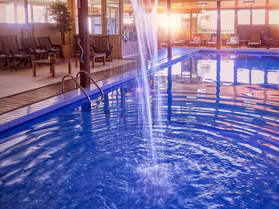 2 indoor pools, outdoor pool, open noon to 9:00 PM, pool umbrellas