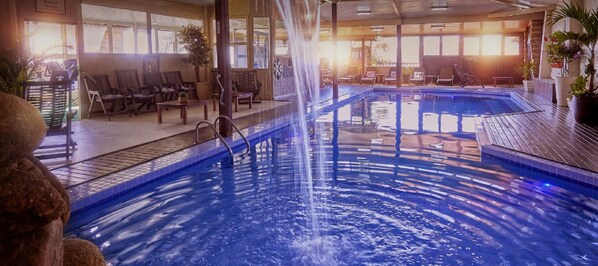 2 indoor pools, outdoor pool, open noon to 9:00 PM, pool umbrellas