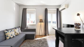 Premium Apartment, 1 Bedroom (Historic Boutique Flat) | Living area | Flat-screen TV