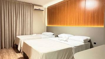Comfort Triple Room | Minibar, laptop workspace, blackout drapes, free WiFi