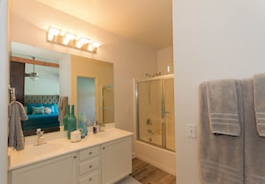 Combined shower/tub, hair dryer, towels, toilet paper