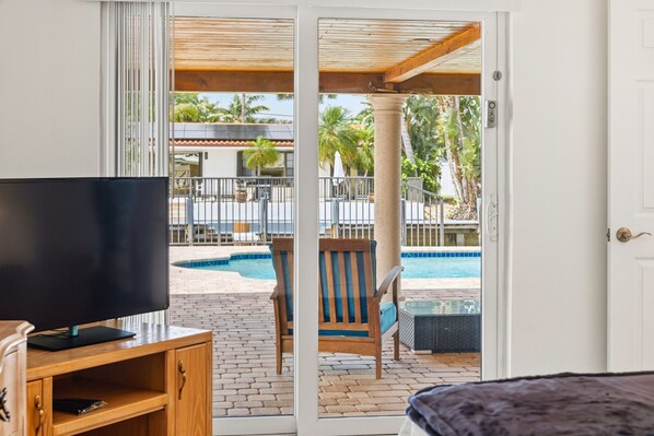 King suite with original art, serene coastal vibe and luxe comfort.