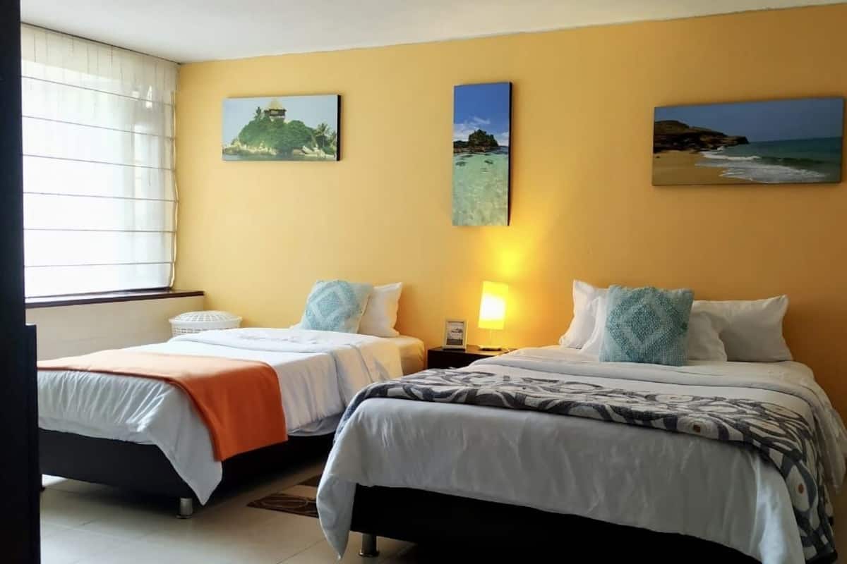 Economy Triple Room, Multiple Beds, Private Bathroom, City View | 1 bedroom, down duvets, individually decorated, individually furnished