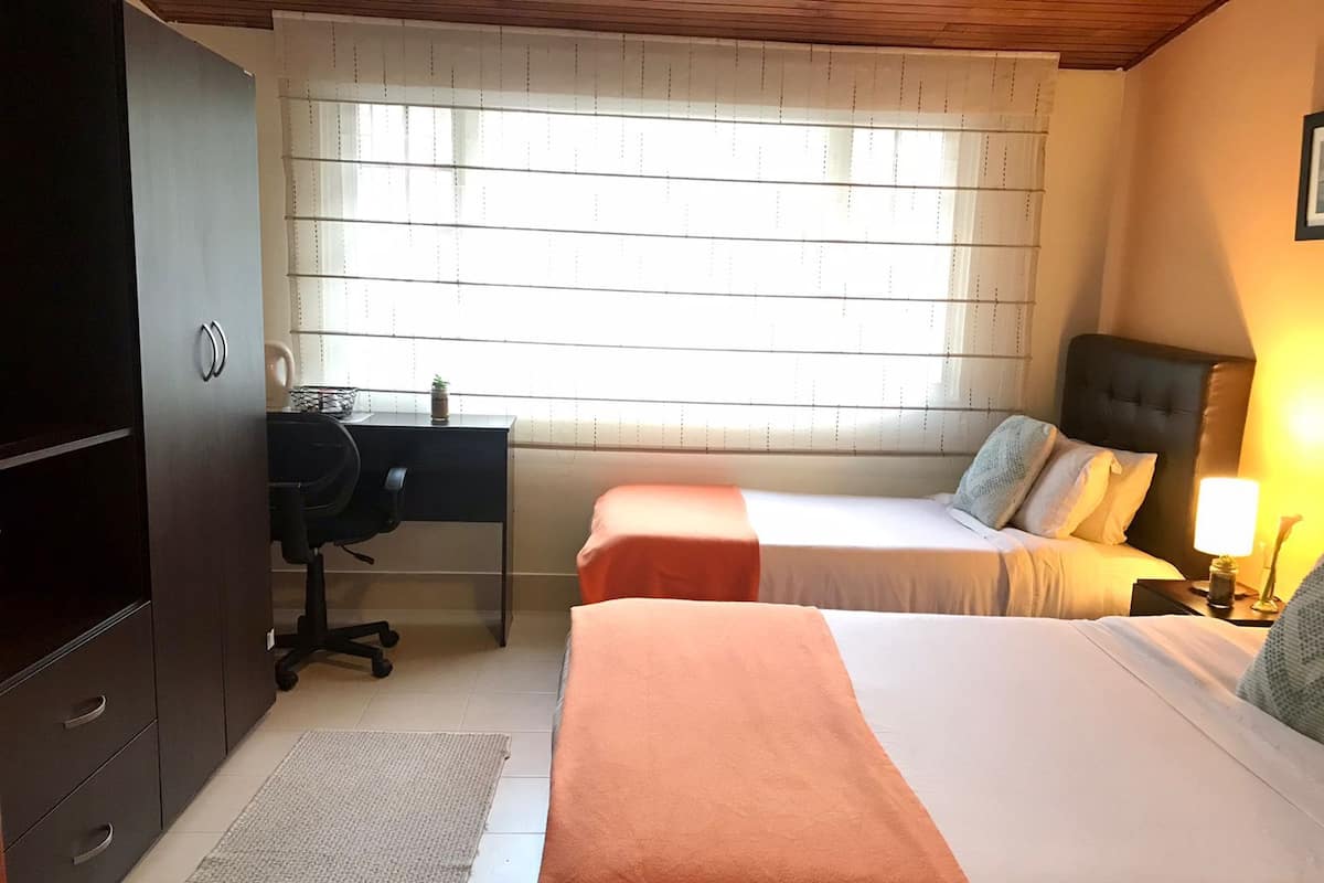 Economy Triple Room, Multiple Beds, Private Bathroom, City View | 1 bedroom, down comforters, desk, iron/ironing board (on request)