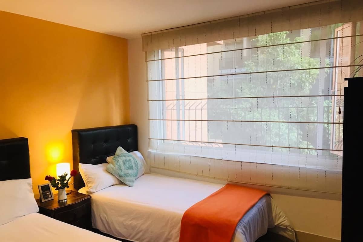 Economy Twin Room, Multiple Beds, Shared Bathroom | 1 bedroom, down comforters, desk, iron/ironing board (on request)