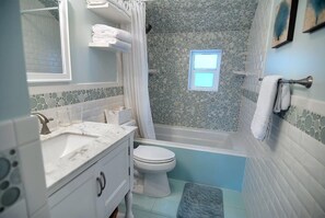 Combined shower/bathtub, hair dryer, towels, soap