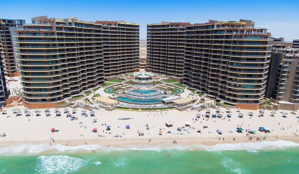On the beach, sun loungers, beach towels