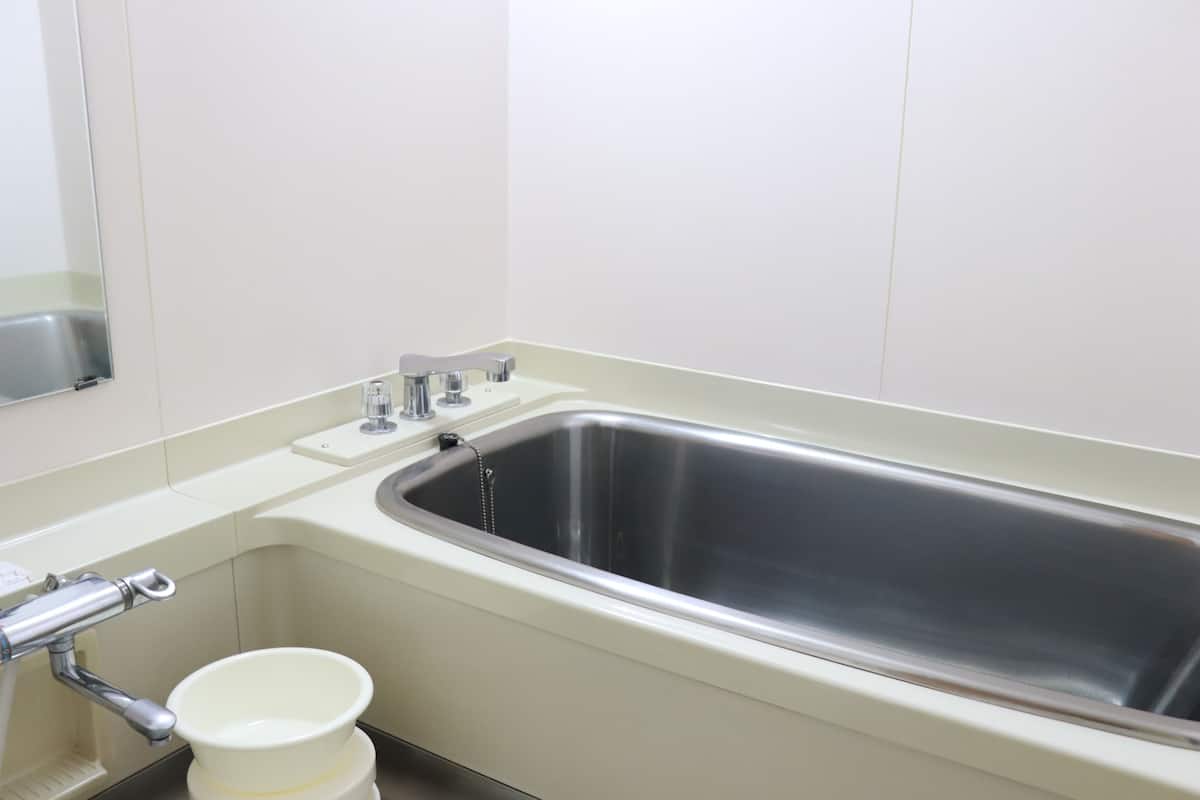 japanese western style room(check-in at hotel gotemba kogen hotel) | bathroom | combined shower/bathtub, free toiletries, hair dryer, slippers