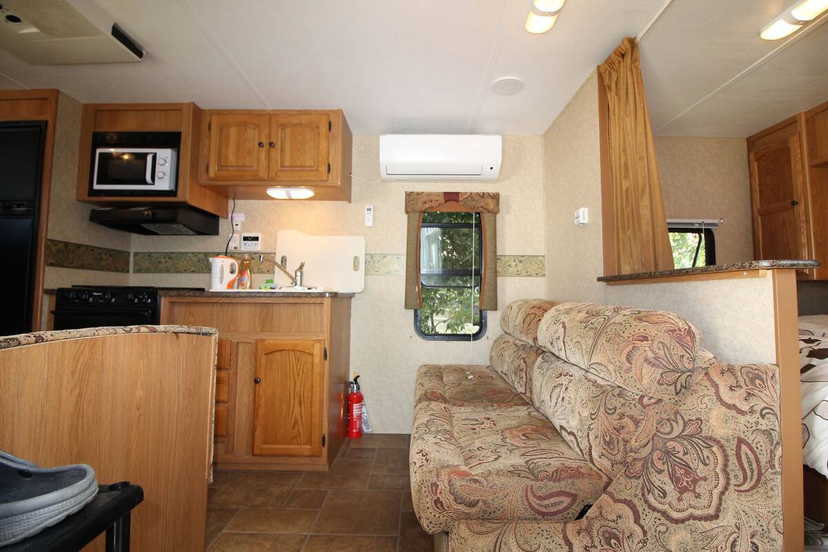 caravan | living area | flat-screen tv