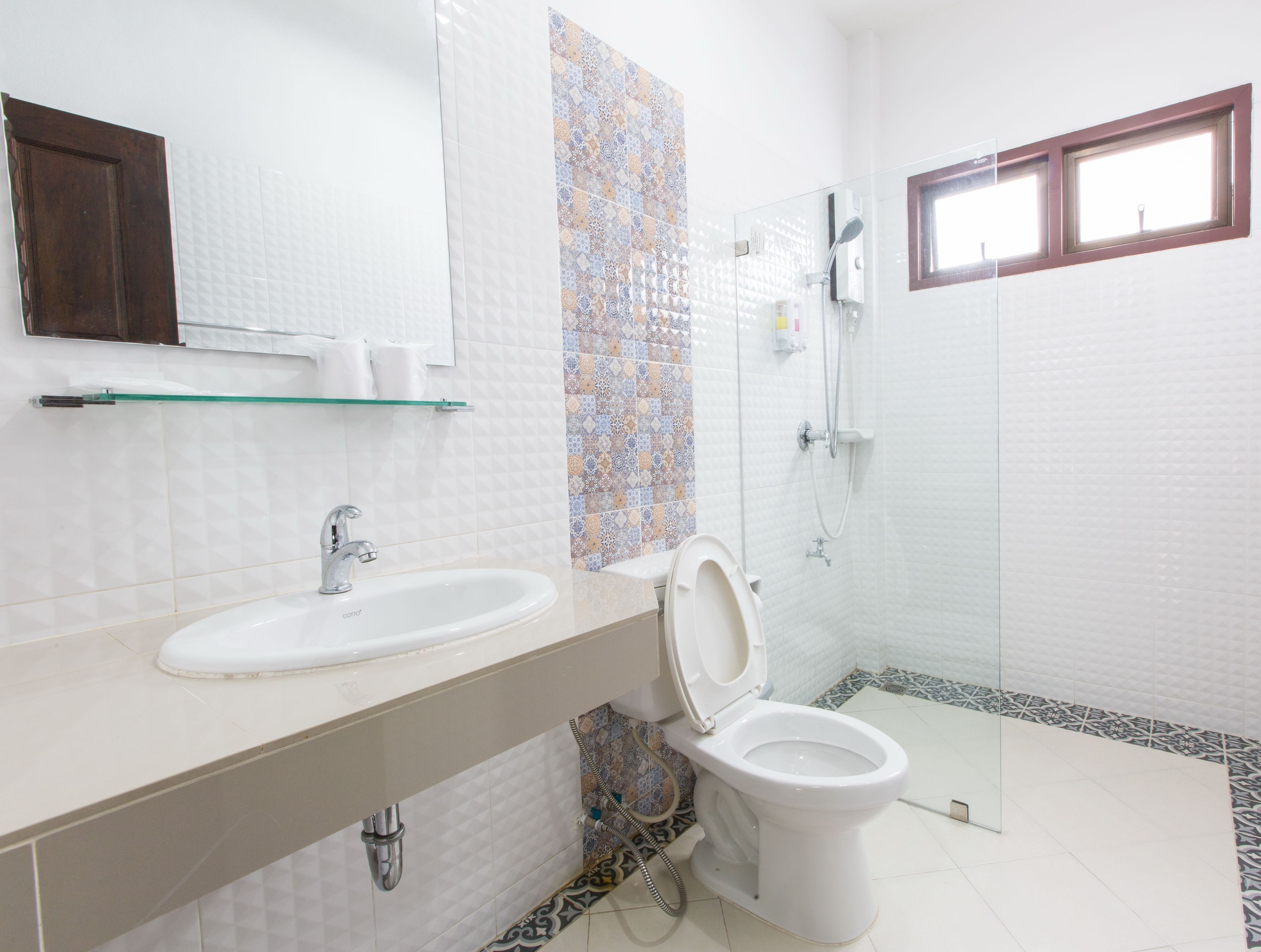 deluxe room with balcony | bathroom | shower, designer toiletries, hair dryer, towels