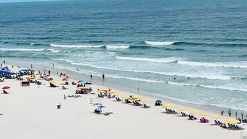 On the beach, sun-loungers
