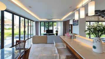 Villa, 4 Bedrooms, Partial Ocean View | Living area | 32-inch flat-screen TV with cable channels, LCD TV