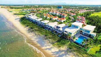 Private beach, white sand, sun loungers, beach umbrellas