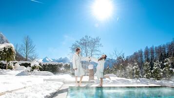 Outdoor pool, open 2:00 PM to 7:00 PM, pool loungers