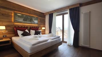 Premium bedding, down comforters, memory foam beds, minibar