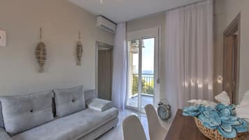 Suite, 2 Bedrooms | Living area | 30-inch LCD TV with satellite channels, TV