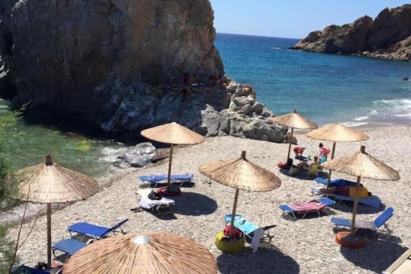 On the beach, sun-loungers, beach umbrellas