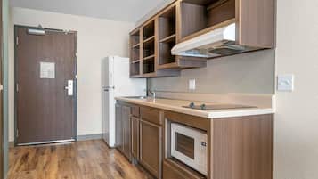 Full-size fridge, microwave, stovetop, freezer