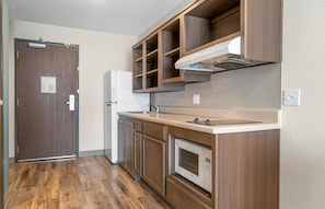 Full-size fridge, microwave, stovetop, freezer