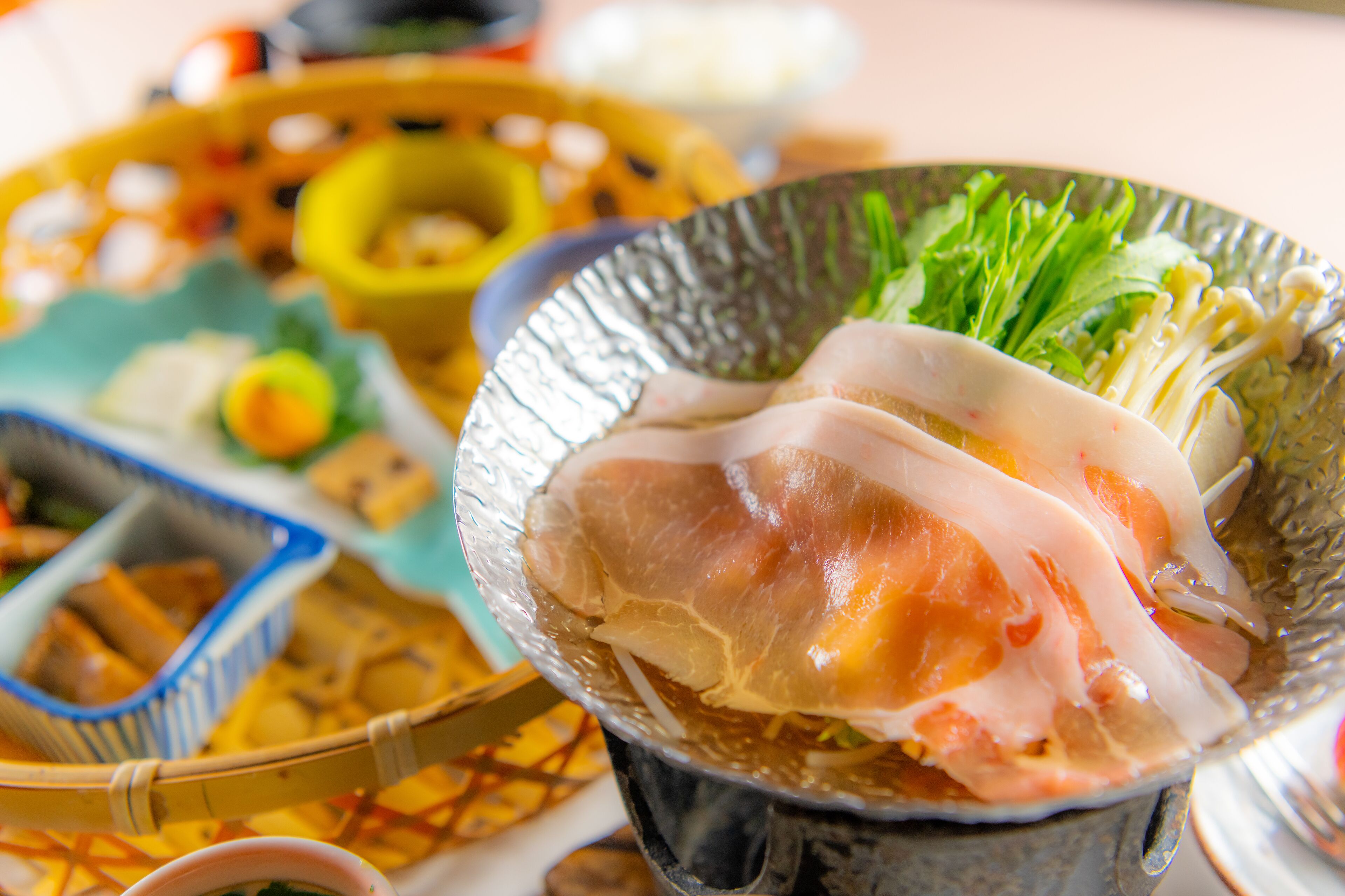 A bowl of food with various ingredients, including vegetables and possibly meat, served on a plate.