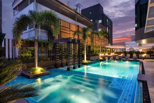 Outdoor pool, open 6:00 AM to 10:00 PM, pool umbrellas, sun loungers