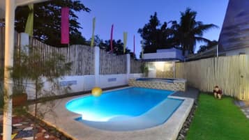 Outdoor pool, open 8 AM to 9 PM, pool umbrellas