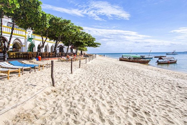 On the beach, sun-loungers, beach towels