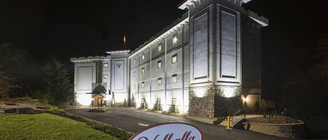 A large, illuminated building with a sign reading "Valhalla Resort Hotel".