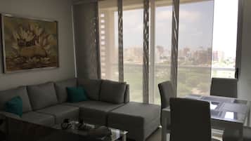Apartment, 2 Double Beds | Living area | 32-inch flat-screen TV with cable channels, TV
