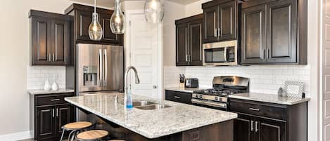 Townhome, Multiple Beds, Pool View (The View At The Escapes) | Private kitchen | Full-sized fridge, microwave, oven, stovetop