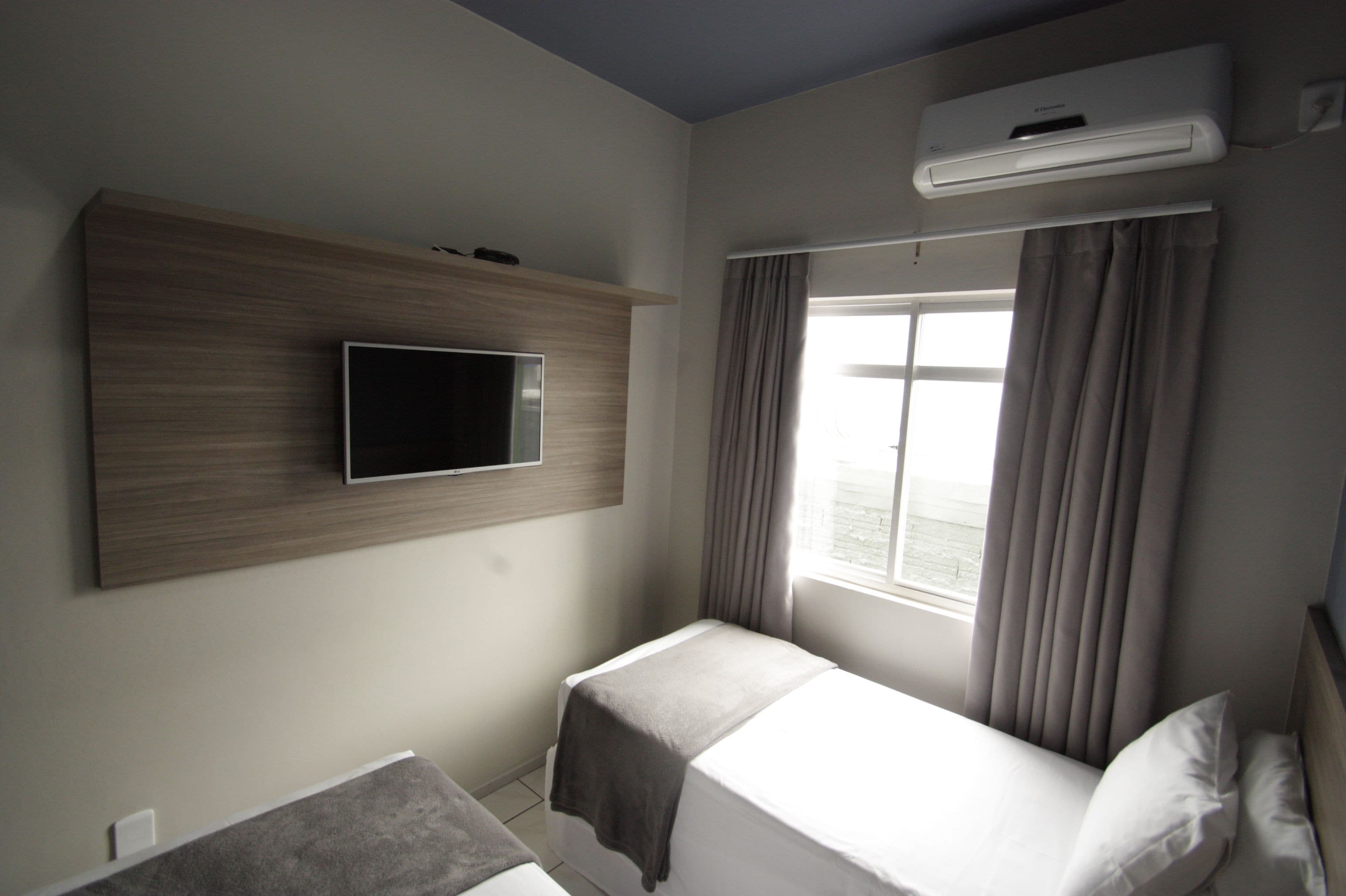 Quarto duplo | Frigobar, cortinas blackout, Wi-Fi de cortesia