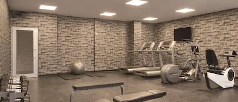 A gym with treadmills, elliptical machines, free weights, and exercise balls.