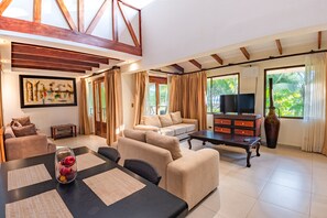 Exclusive House, 4 Bedrooms, Beachside | Living area | 40-cm Smart TV with cable channels, TV - Sunset Del Mar Resort (Parrita)