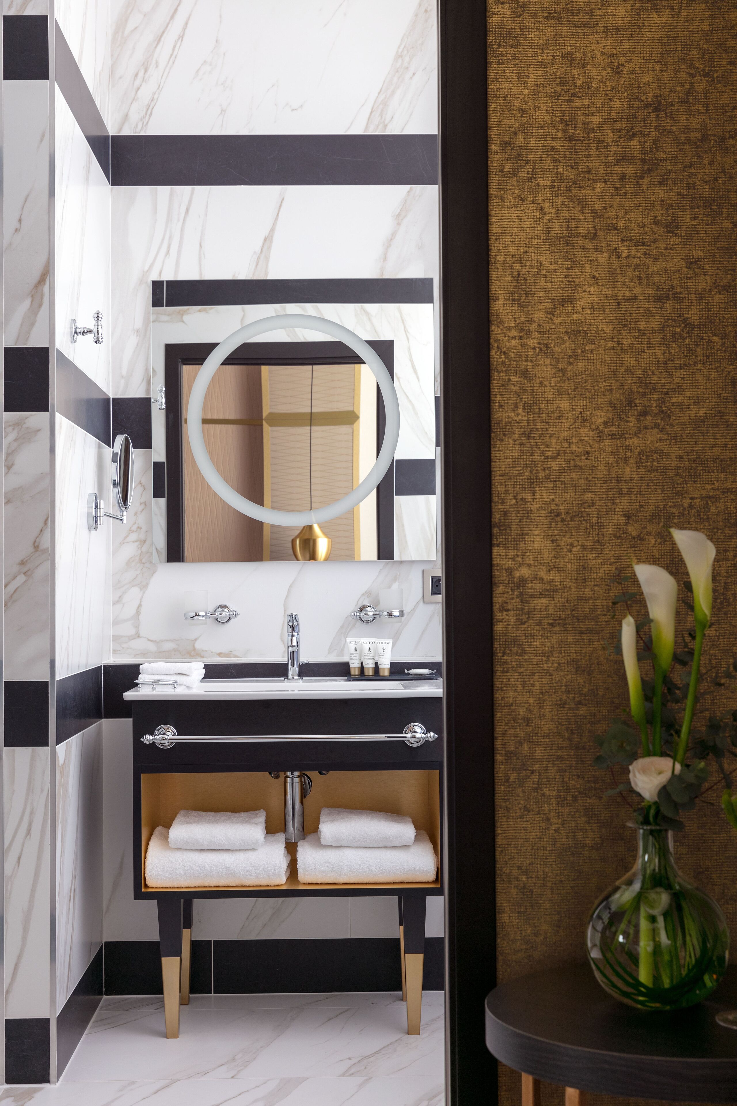 designer toiletries, hair dryer, bathrobes, slippers