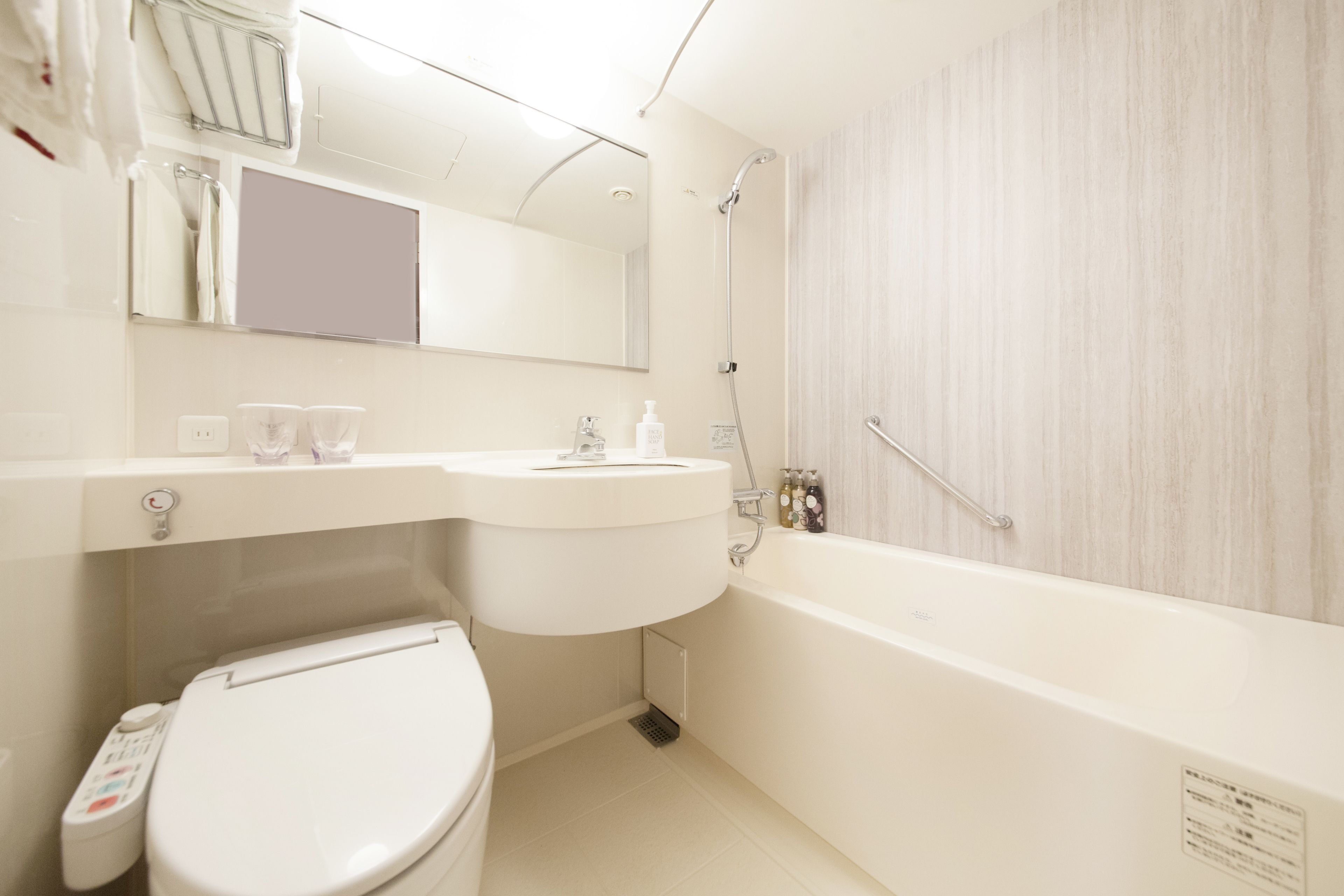 combined shower/bathtub, free toiletries, hair dryer, slippers